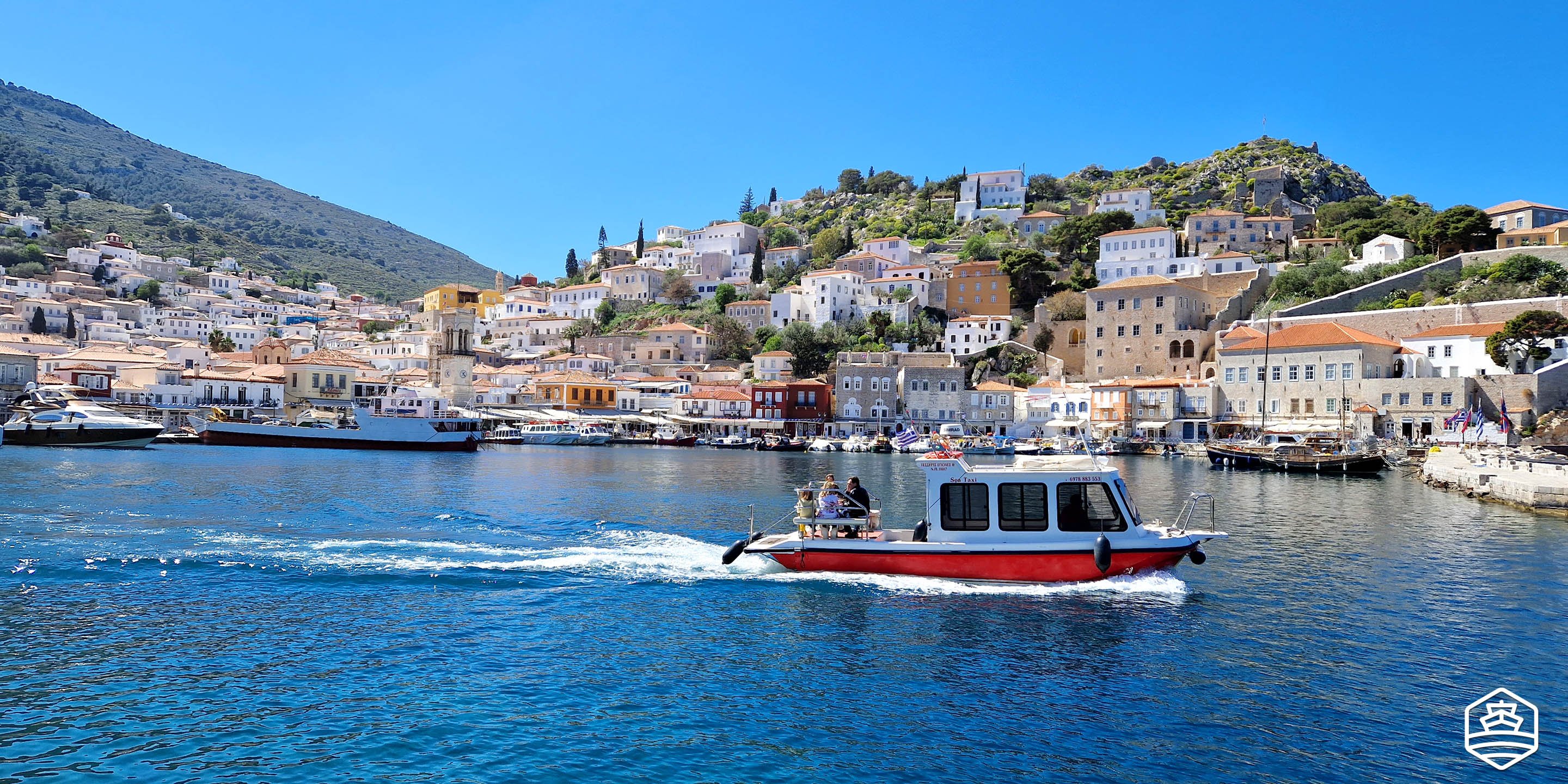 A taxi boat leaving the port of Hydra town