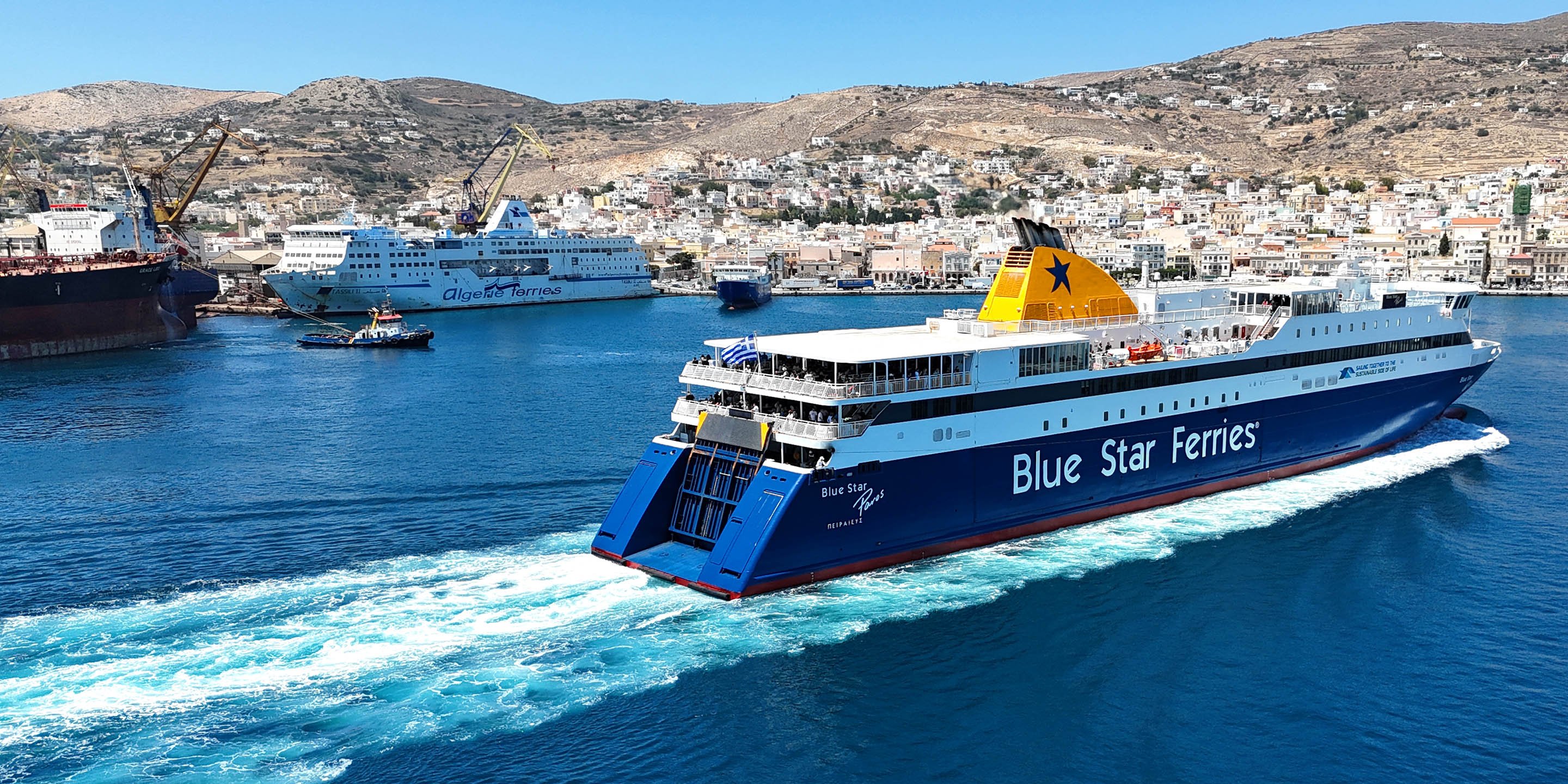 The Ferry Blue Star Paros arriving in Syros from the port of Piraeus in Athens